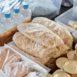 Boxes of groceries and canned food packed for donation as food parcels in South Africa