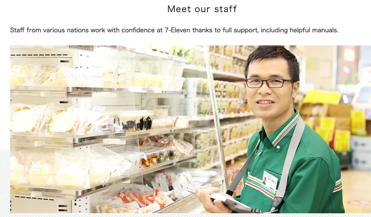 Official 7-Eleven Japan page saying staff from various nations work with full support including manuals